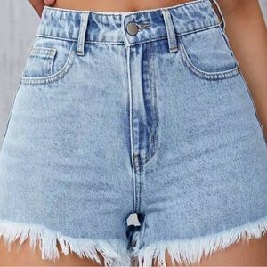 Jean shorts, flowers on the back pocket.